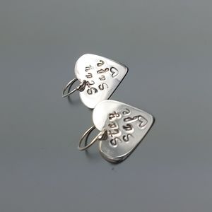 Sterling silver heart shaped "Stay Safe" earrings